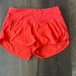 Lululemon Red speed up medium rise shorts in size US 4